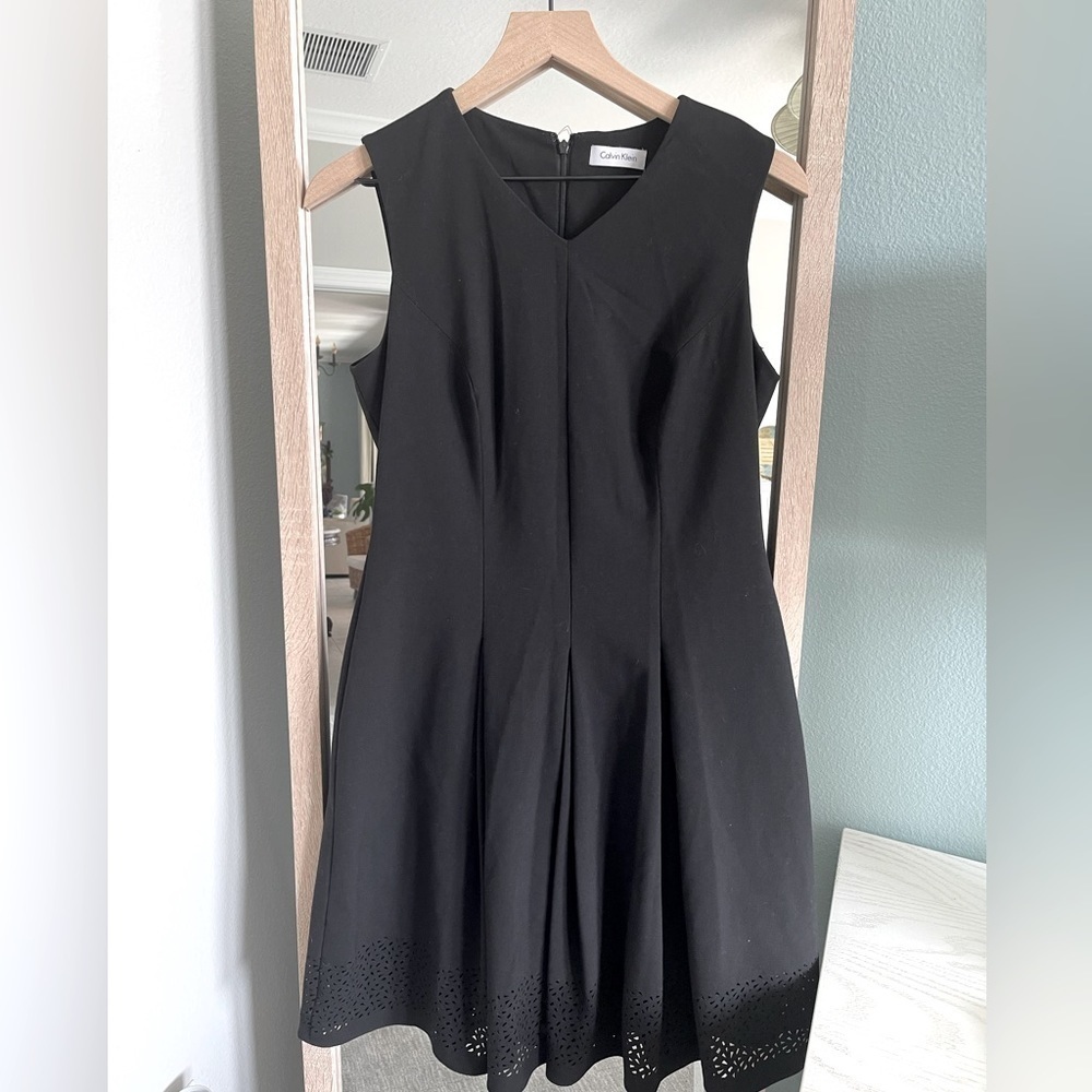 Calvin Klein A line flare black dress with cutout hem detail size 10